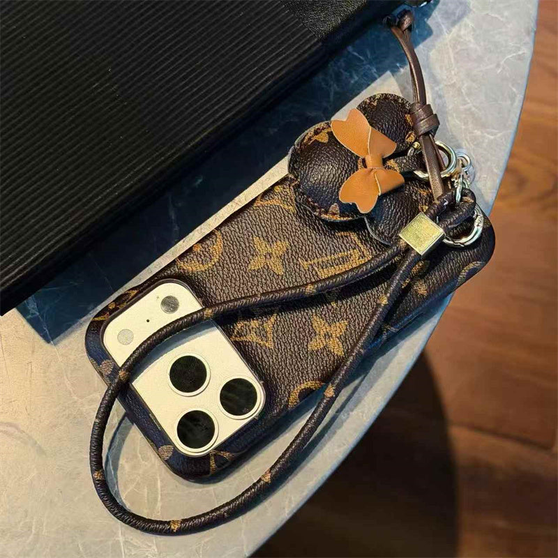 Luxury Monogram Case with Bow Charm & Wrist Lanyard for iPhone 12-18 Pro & Pro Max