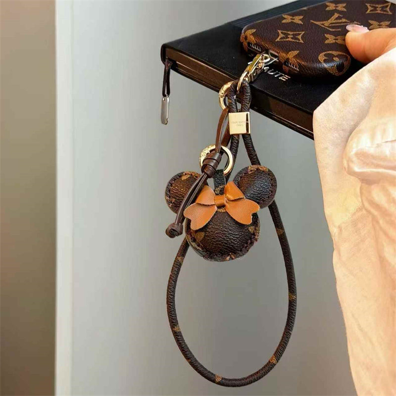 Luxury Monogram Case with Bow Charm & Wrist Lanyard for iPhone 12-18 Pro & Pro Max